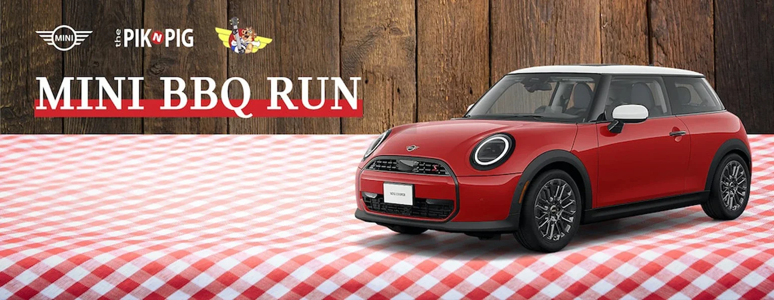 Red Mini Cooper on a checkered picnic blanket with Mini, Pik N Pig logos, and 'MINI BBQ RUN
